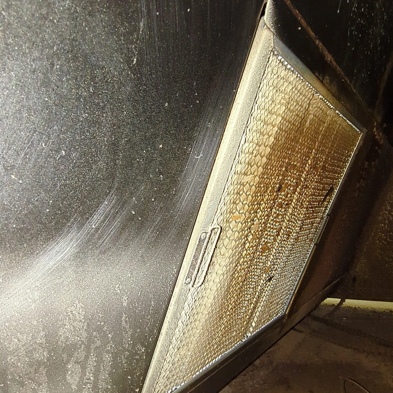 Oven hood filter before cleaning
